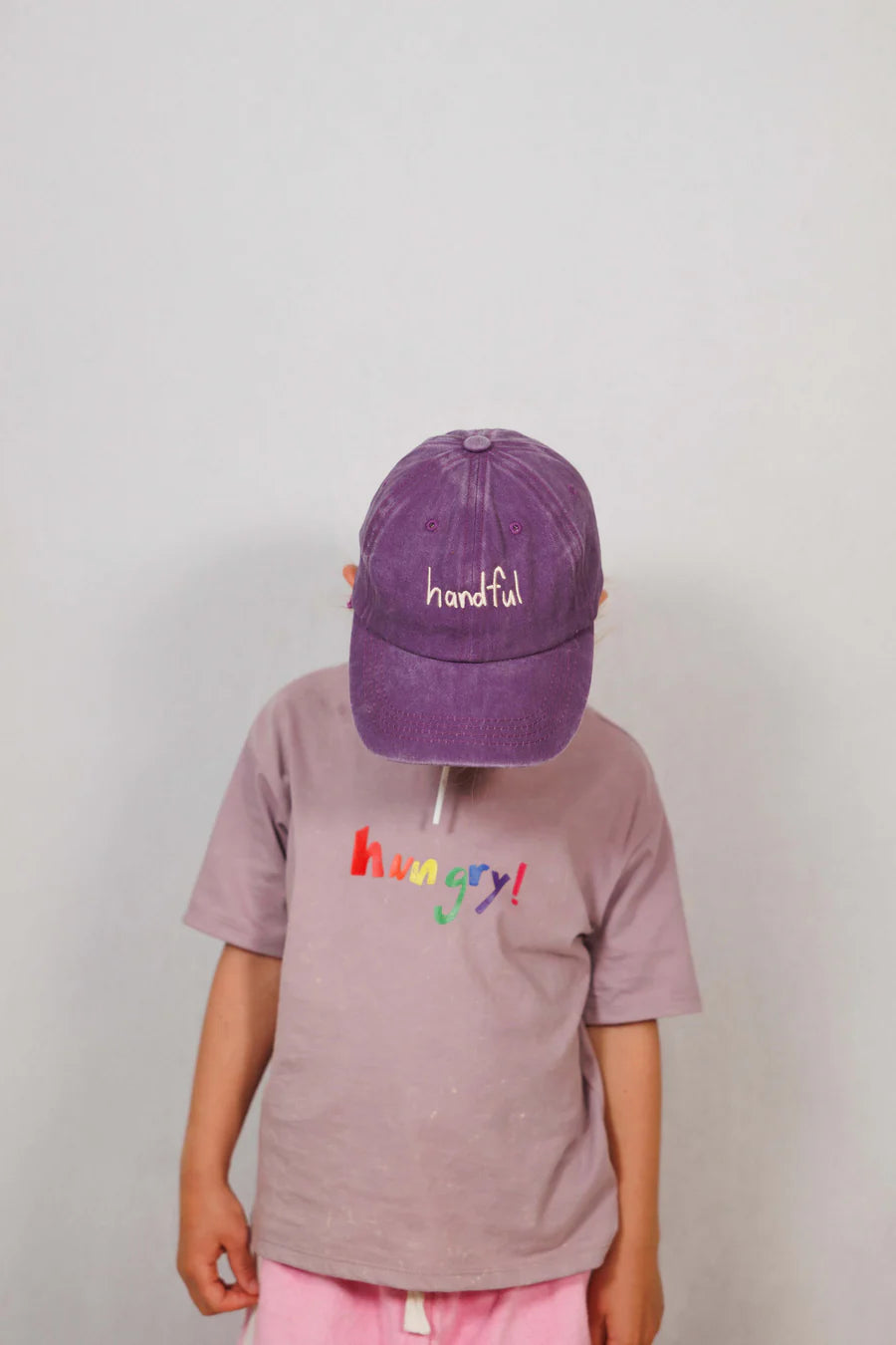 Purple cotton cap with “handful” text in white