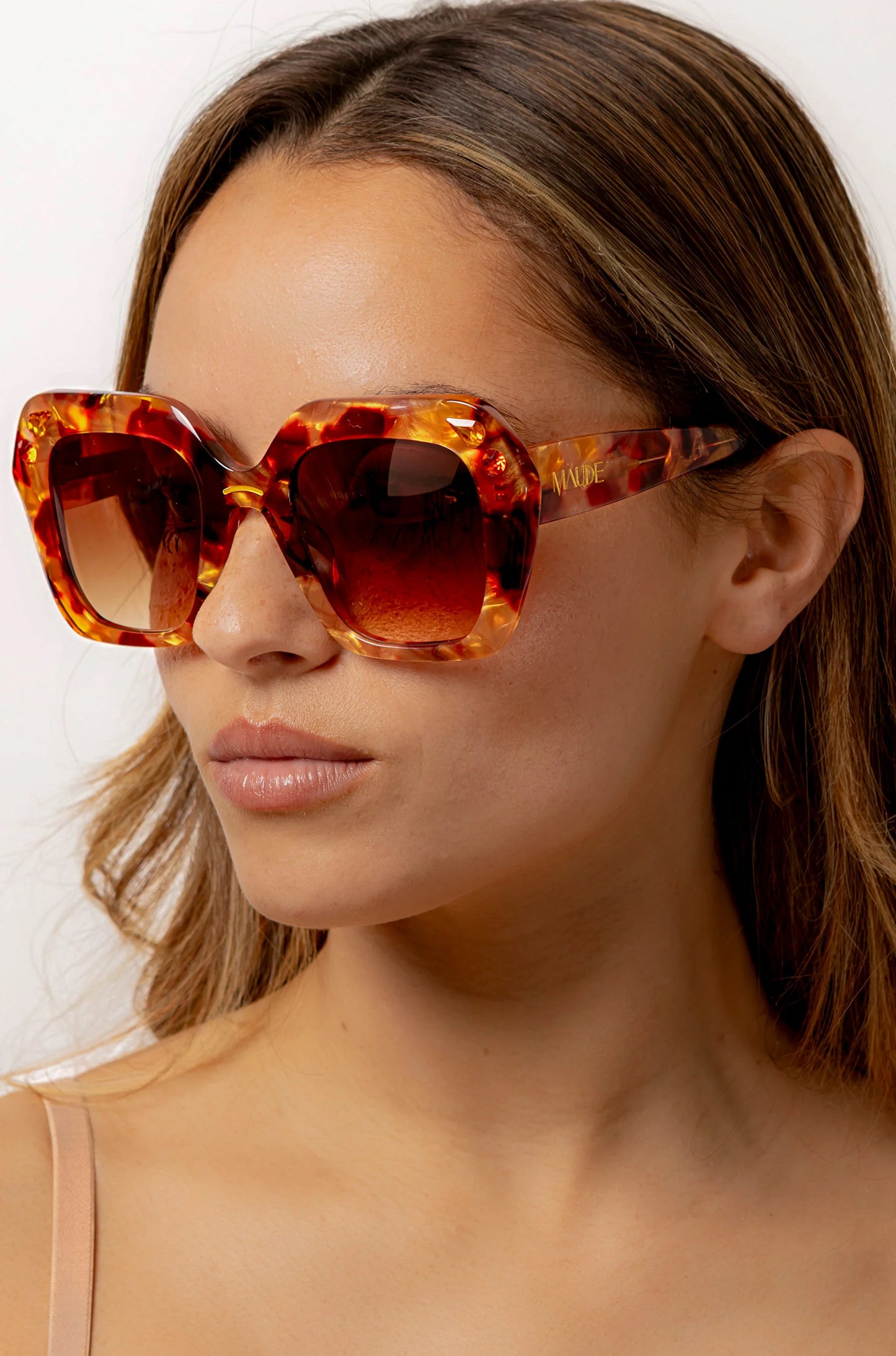 Oversized oval sunglasses in red and apricot tort with crystals