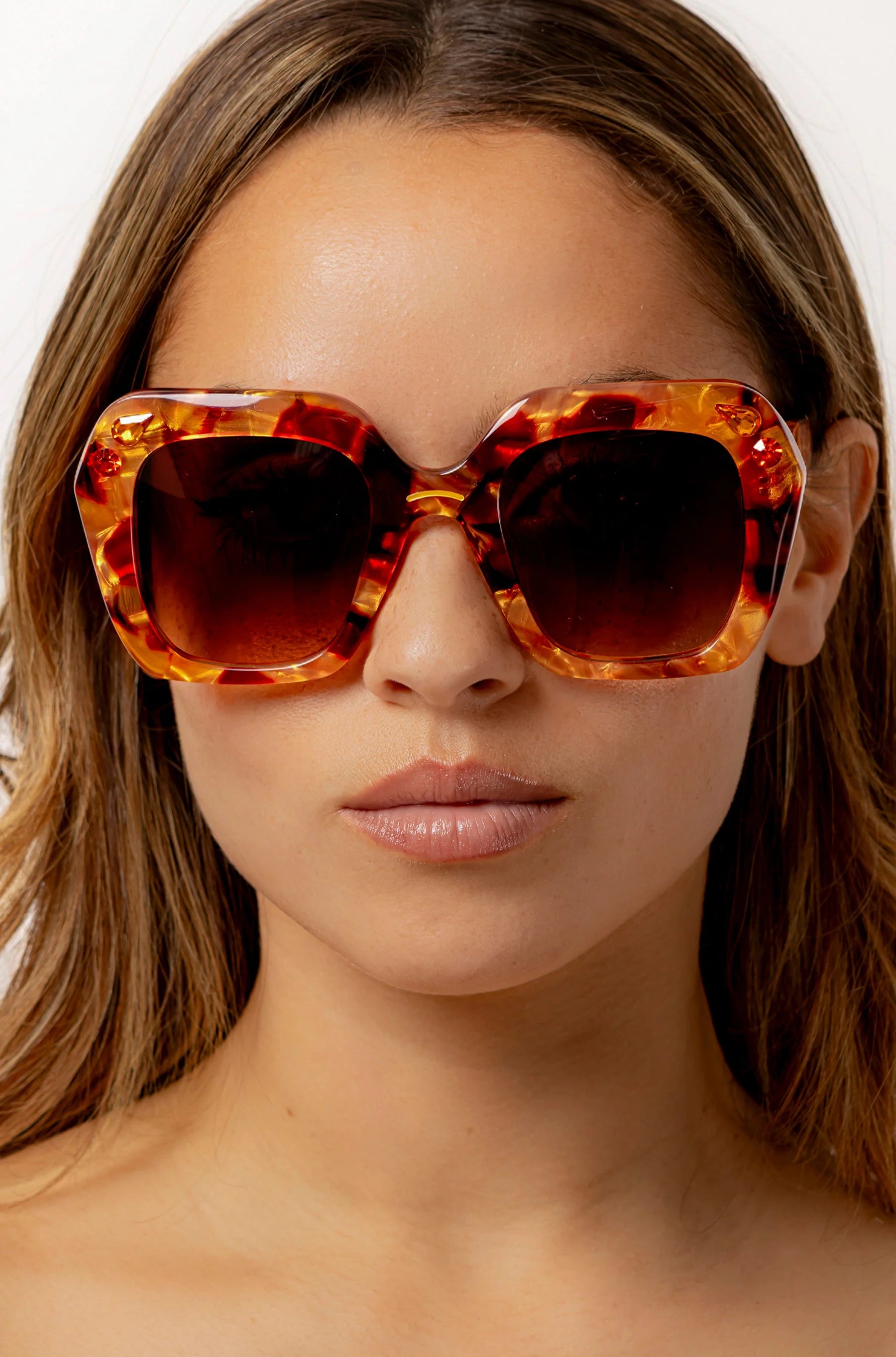 Oversized oval sunglasses in red and apricot tort with crystals