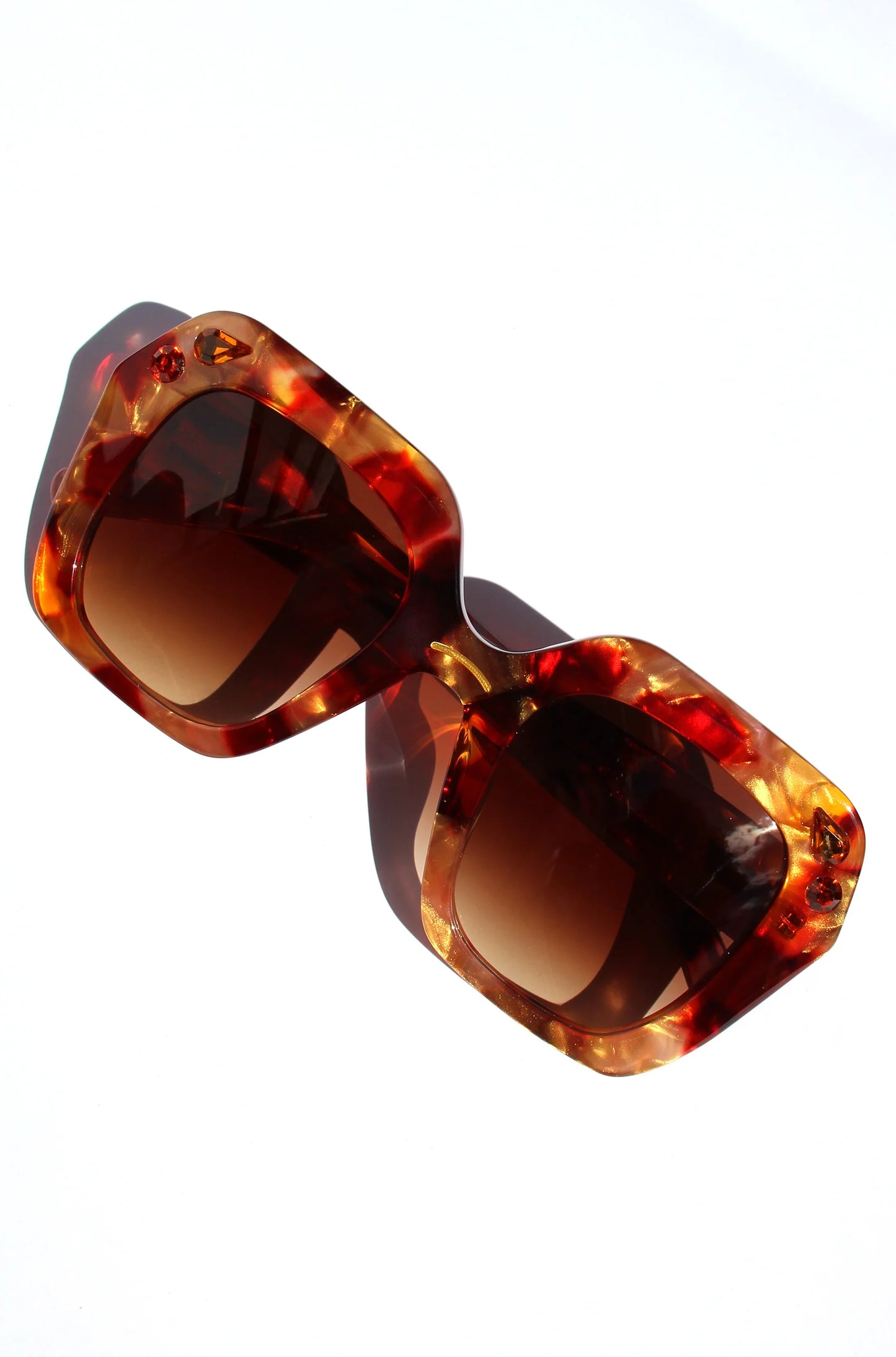 Oversized oval sunglasses in red and apricot tort with crystals