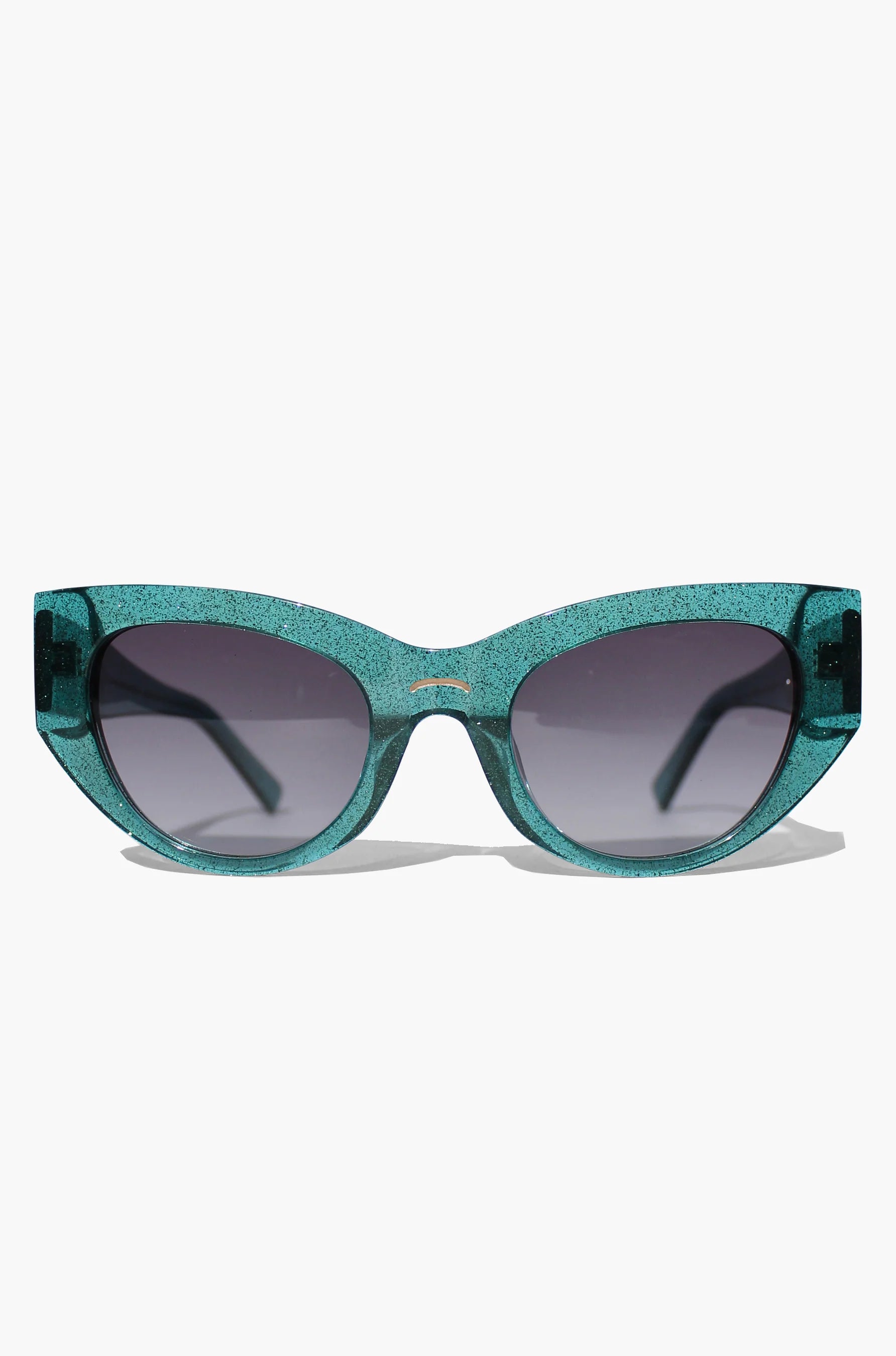 Woman wearing green almond shaped sunglasses in green shimmer acetate
