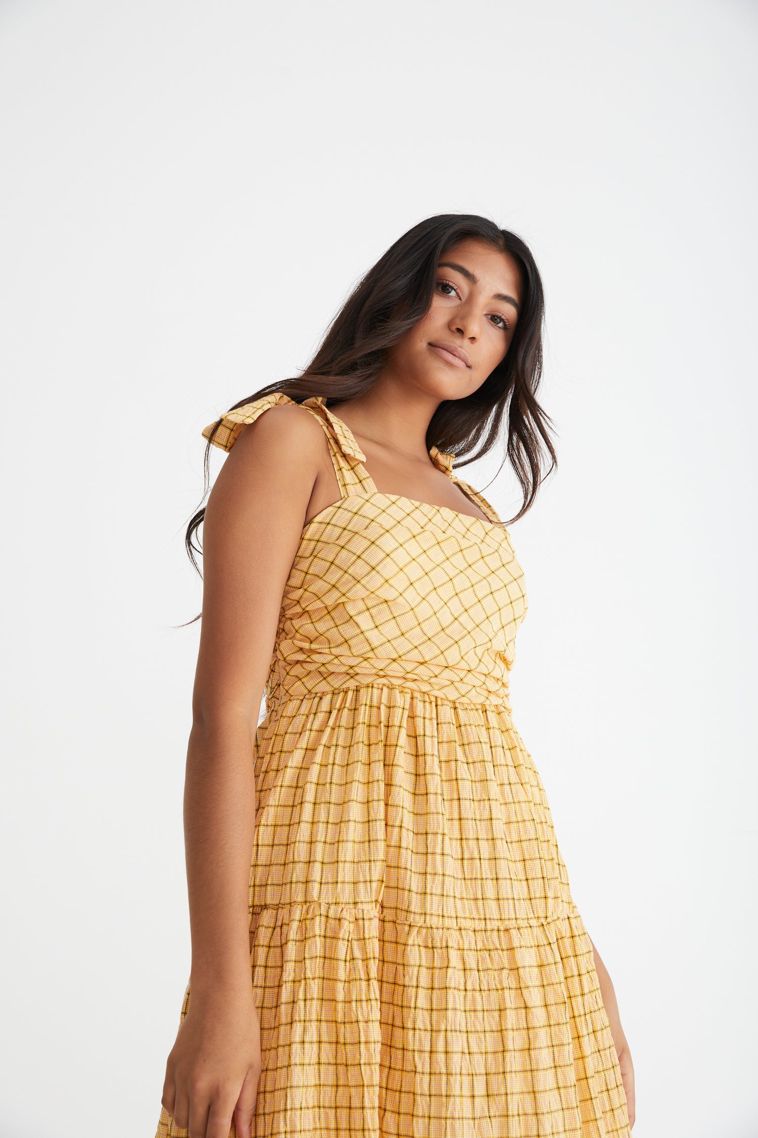 Sunflower maxi with tiered and gathered skirt, rouched bodice and tie up straps in a buttercup yellow and brown check print