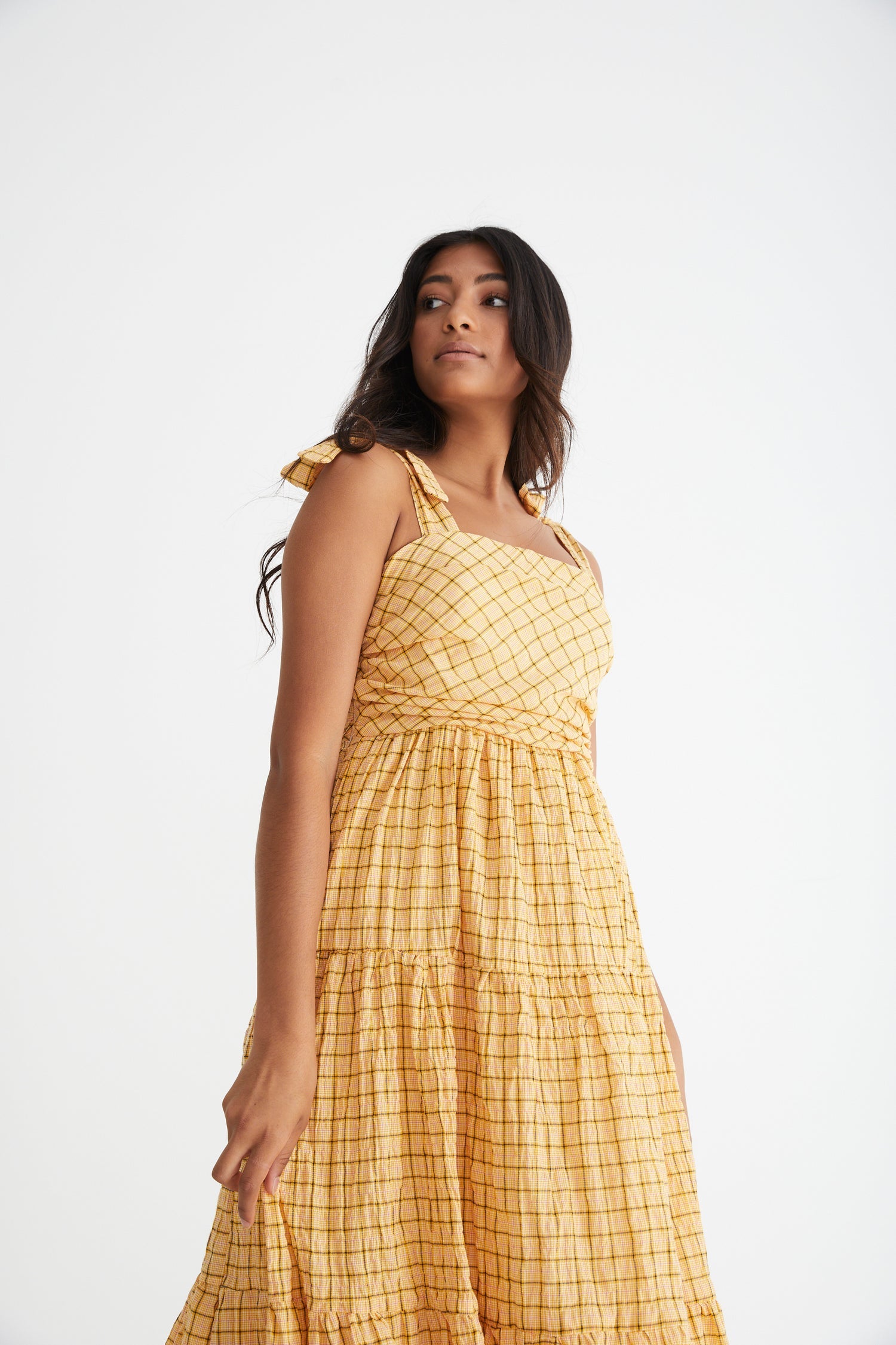 Sunflower maxi with tiered and gathered skirt, rouched bodice and tie up straps in a buttercup yellow and brown check print